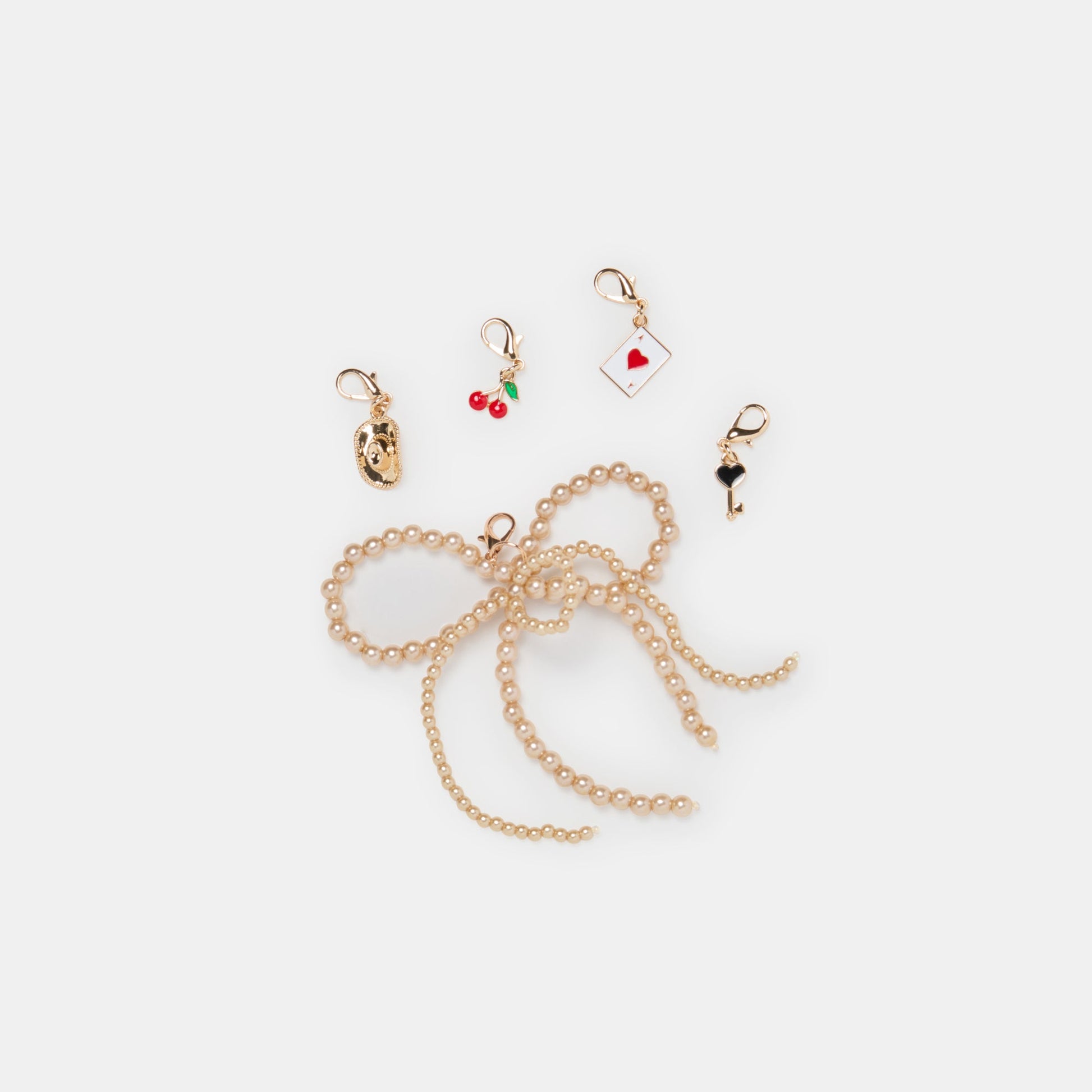 GOLD BOW CHARM PACKAGE ASSORTED - Dolce Vita